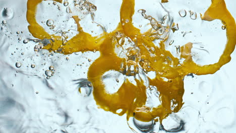 yellow pepper splashing water in super slow motion close up. vitamin vegetable.