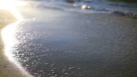 waves breaking on the sand