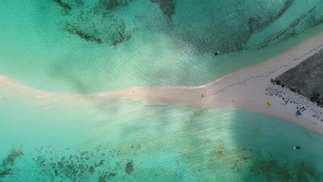 clouds move over tropical island, aerial top down view cayo de agua, los roques