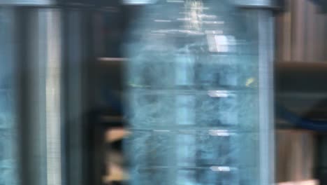 new plastic bottles on the conveyor belt of a drinking water plant