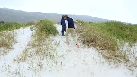 Siblings-chasing-each-other-on-the-sand-dunes