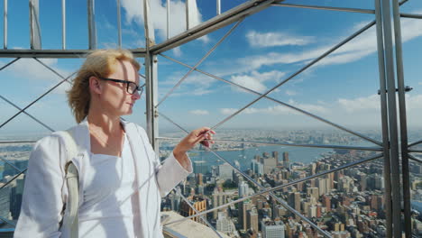 Portrait-Of-A-Young-Woman-Admiring-A-Beautiful-View-Of-The-City-Of-New-York