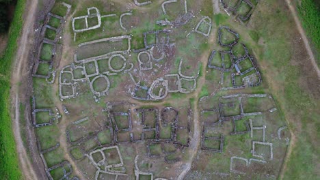 ancient stone ruins of castro de rey in lugo, galicia, seen from an aerial view on a cloudy day