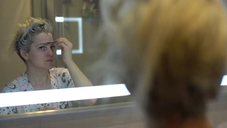 woman-dyes-her-hair-and-eyebrows-herself