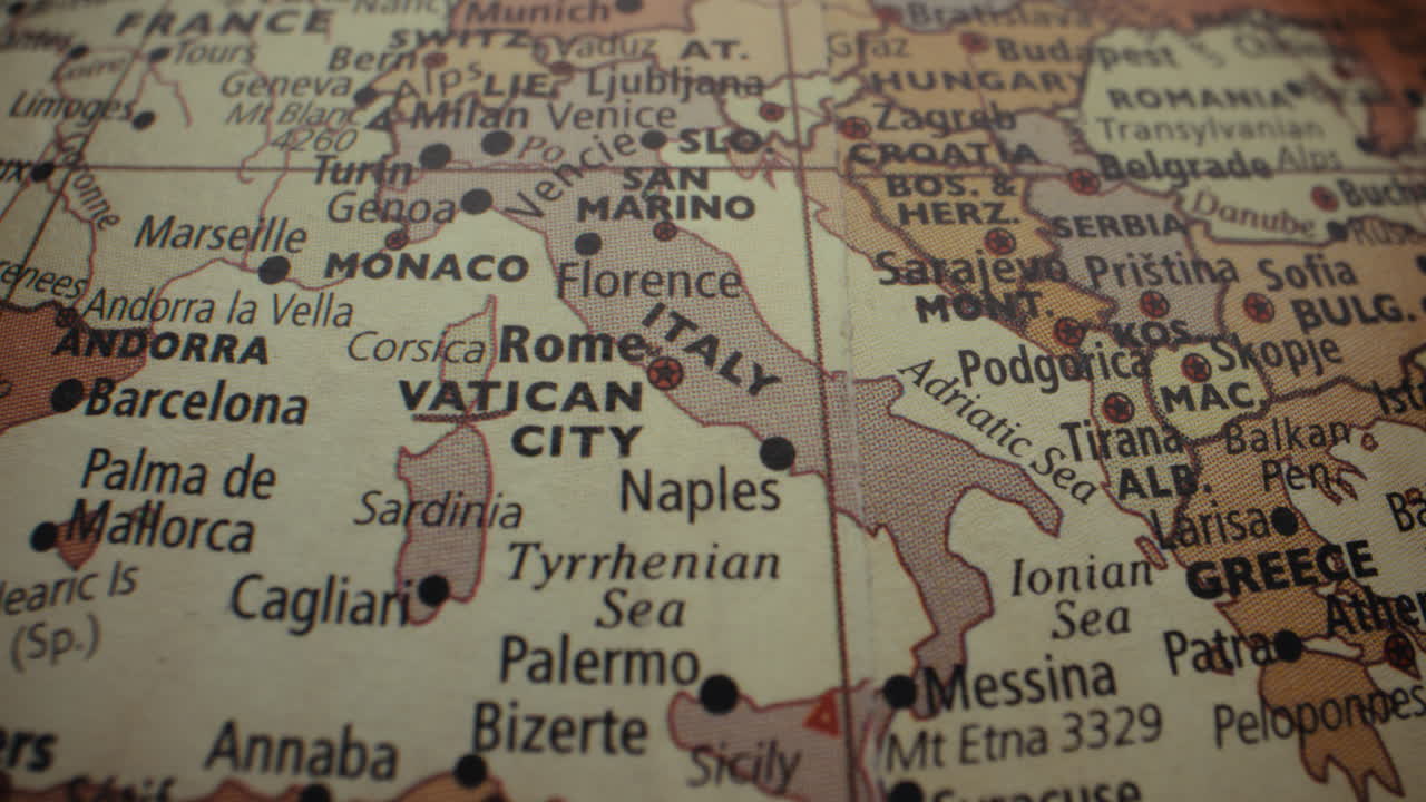 Close-up of a vintage world map focusing on Italy and surrounding countries