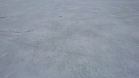 Flying-above-a-frozen-mountain-lake