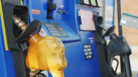 man pays with credit card and enters a pin code at a gas station