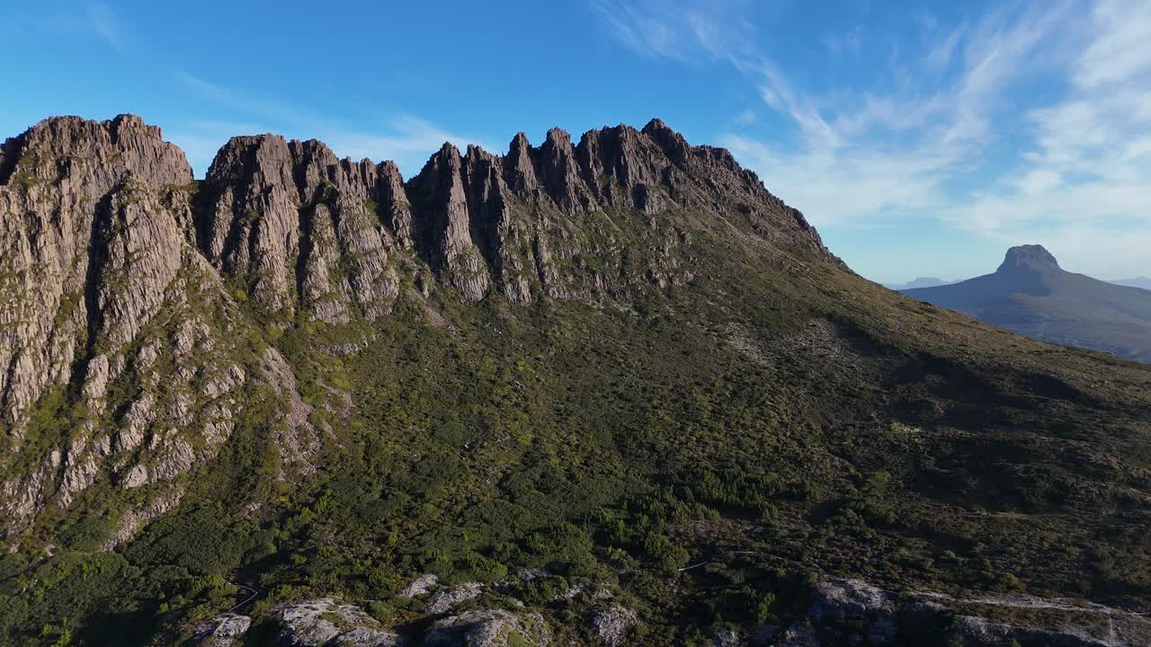 Cradle Mountain peak in Central Highlands region of Tasmania, Australia. Aerial backward