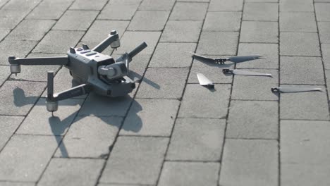 crashed drone lays on the ground and damaged