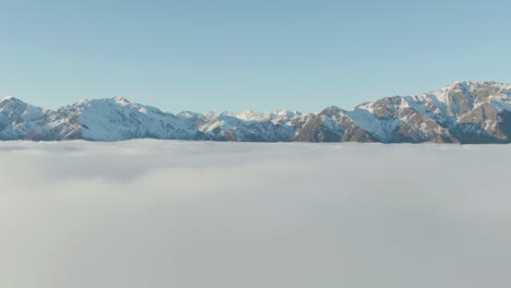 drone flying above clouds in wanaka