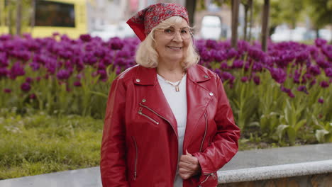 happy senior woman smiling looking away dreaming resting good news feel satisfied in city street