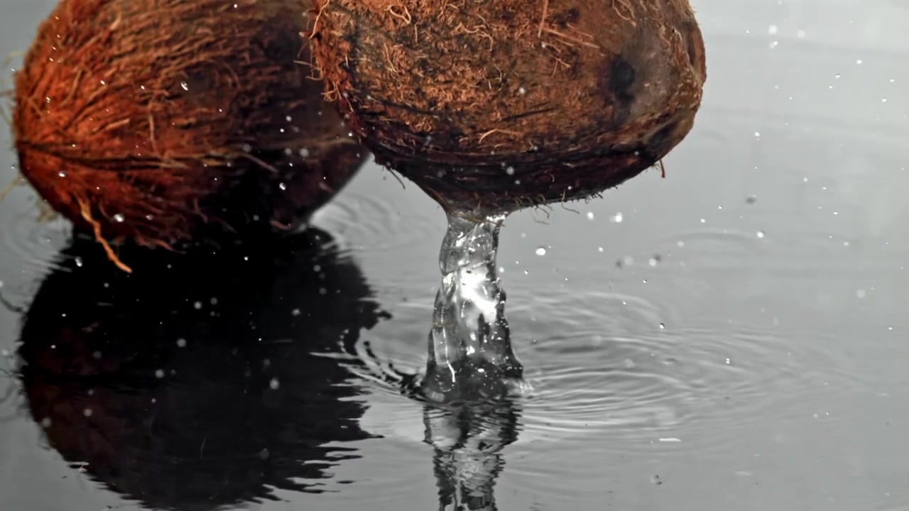 Slow Motion of Coconut Dropping and Splashing into Water