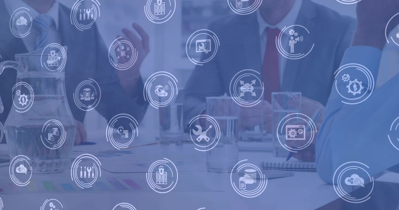 Business Meeting with Digital Technology Icons Overlay