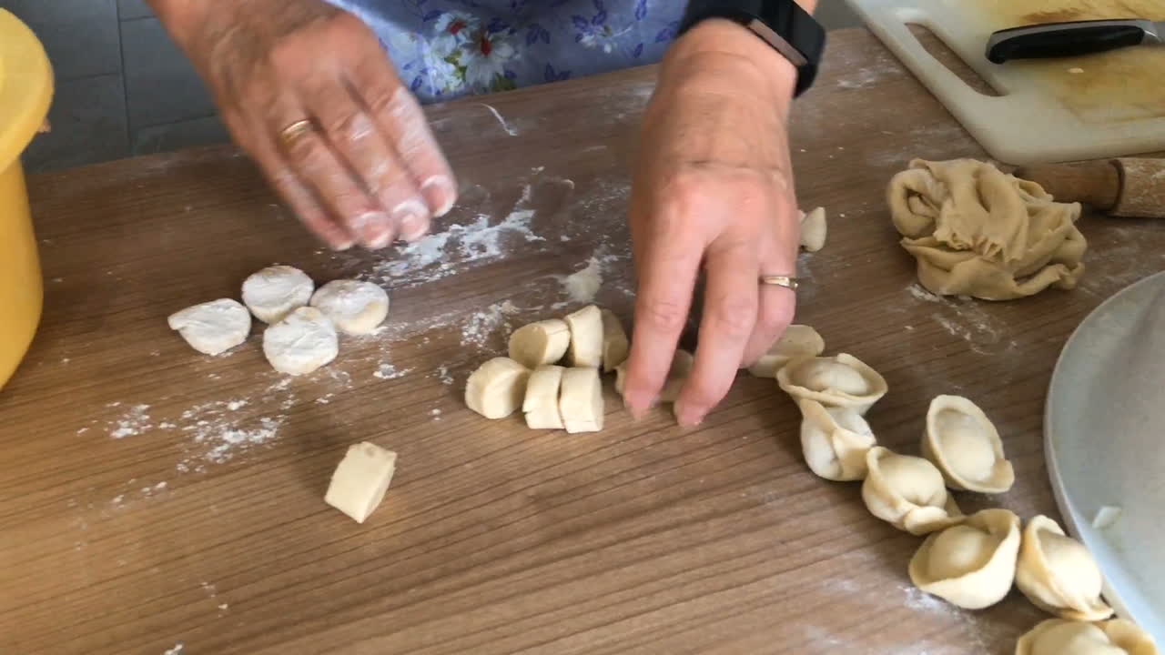 the woman kneads the dough