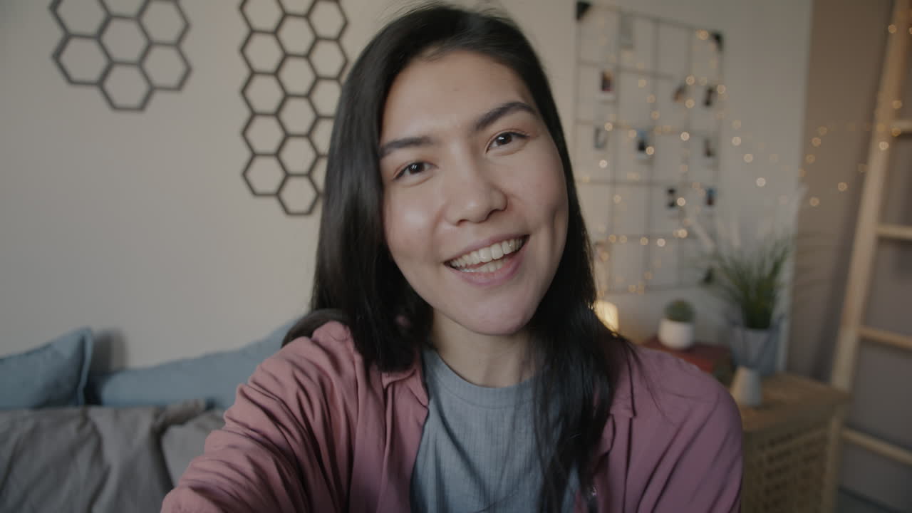 Woman Smiling During a Video Call