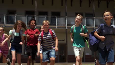 group of kids running in the school