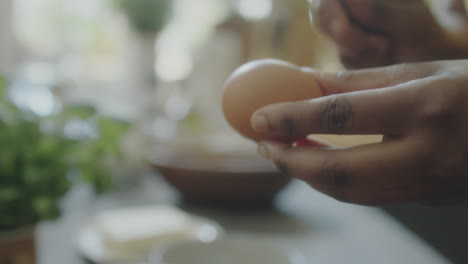 cracking egg into bowl
