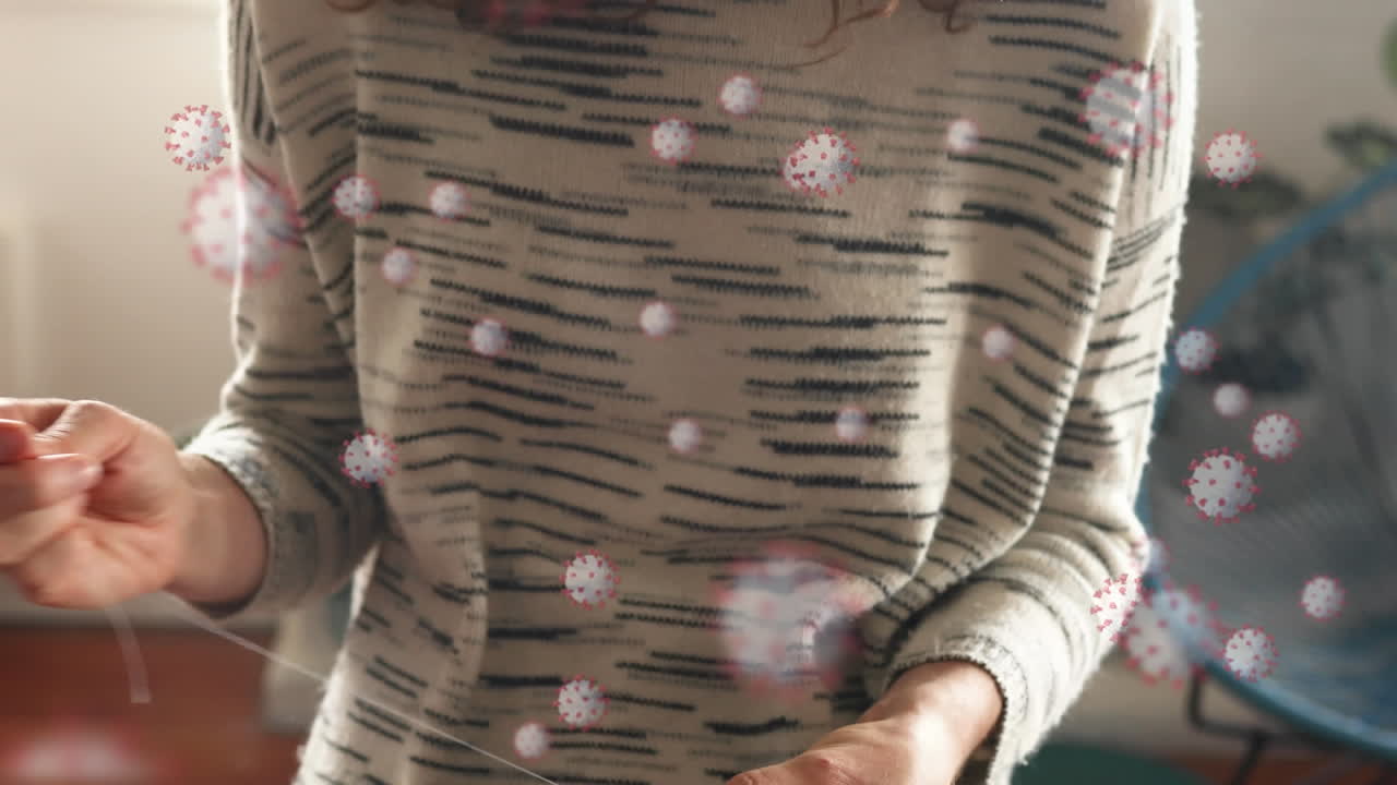 코로나 19 세포의 애니메이션이 마스크를  ⁇ 는 사람 위에