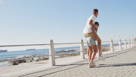 young adult couple having fun at the seaside