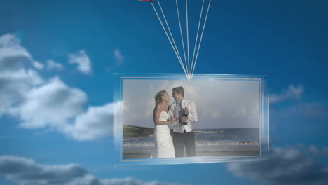 balloons carrying screen showing newlywed couple on beach