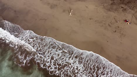 aerial view of gui gui beach, las palmas de gran canaria during calima , 4k drone footage-5