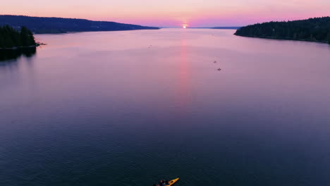 sunset kayaking on a serene bay