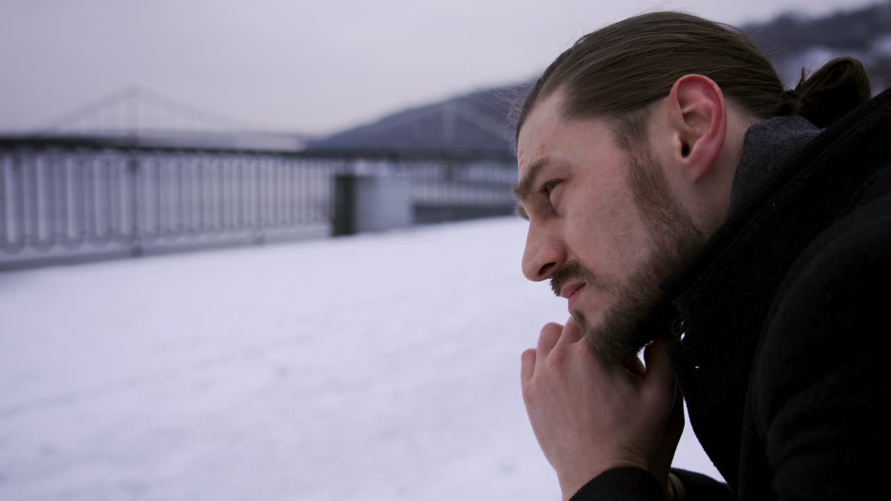 Thoughtful man sitting on a bench