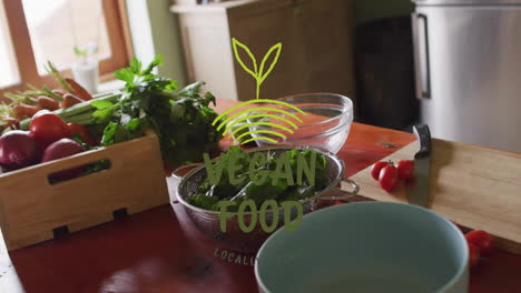 vegan food animation over fresh vegetables and kitchen utensils on wooden table