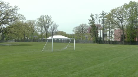 dolly zoom of a soccer-football goal during a sunny summer afternoon