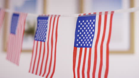 close up of american stars and stripes flag bunting for party celebrating 4th july independence day 2