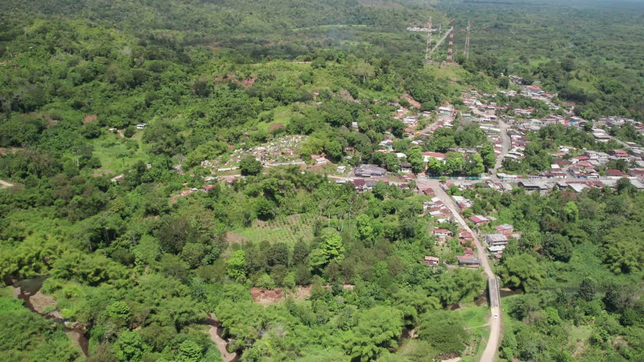 The village of el guapo in miranda, surrounded by lush greenery and hills, aerial view