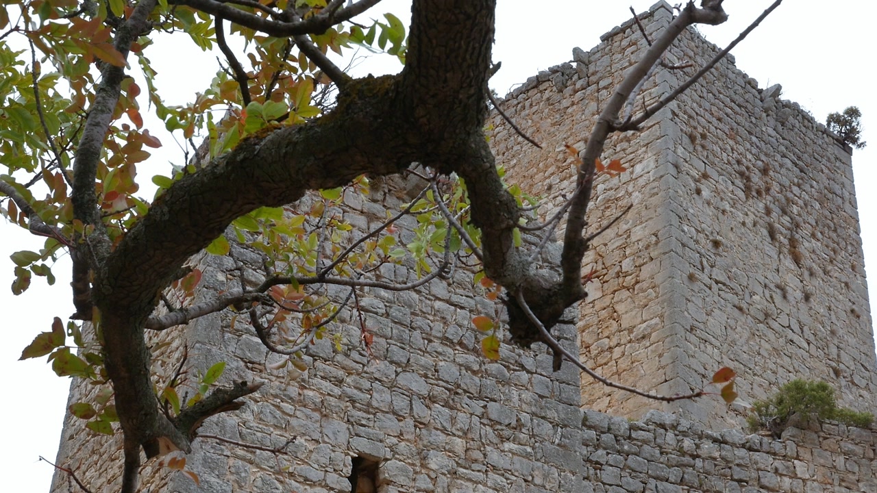 Old stone tower of Otiñar Castle (Jaén), a medieval defensive monument.