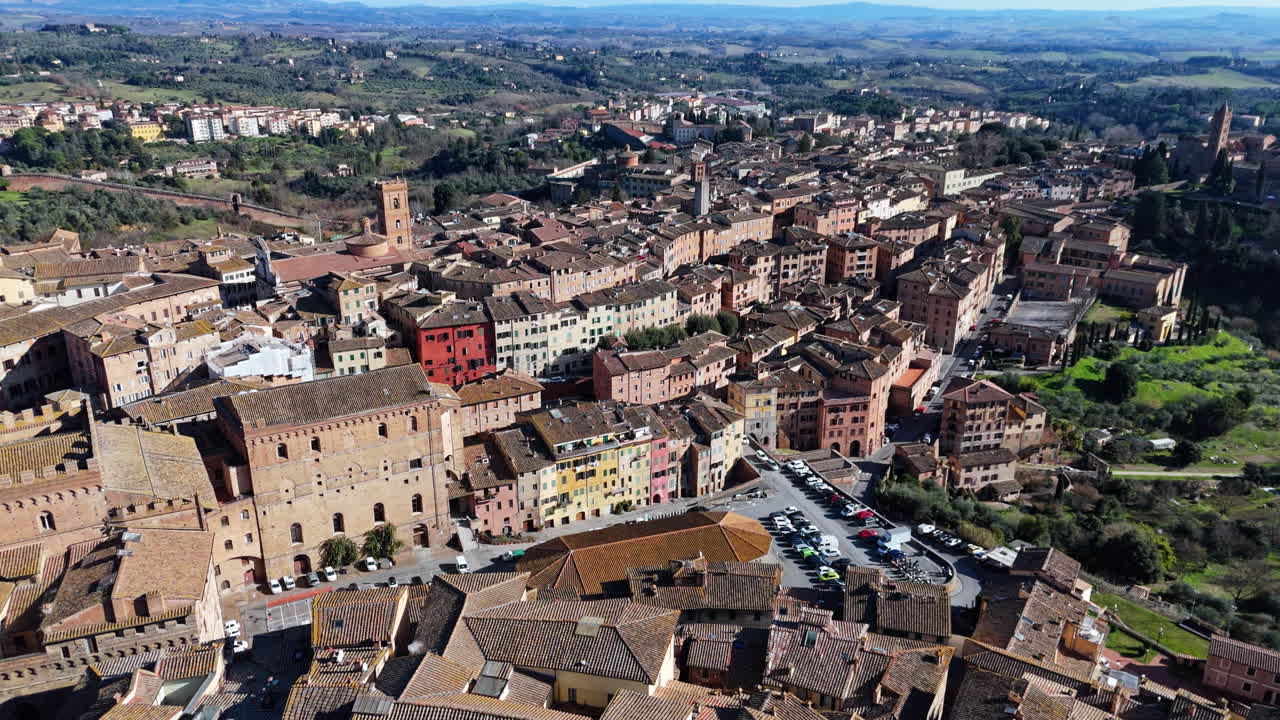 Siena, italy, showing historic buildings, terracotta rooftops, and streets , aerial view