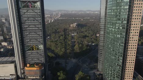 drone flying next to the tall buildings at the mexico city