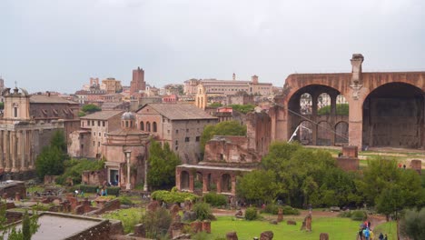 picturesque cityscape aerial view of rome, italy, old ruins and archaeological unesco outdoor historic stone attraction, handheld pan right