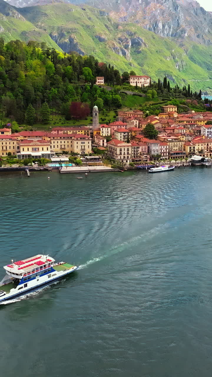 Aerial view of ship navigating on Lake Como on a sunny day near Bellagio, Italy. Vertical