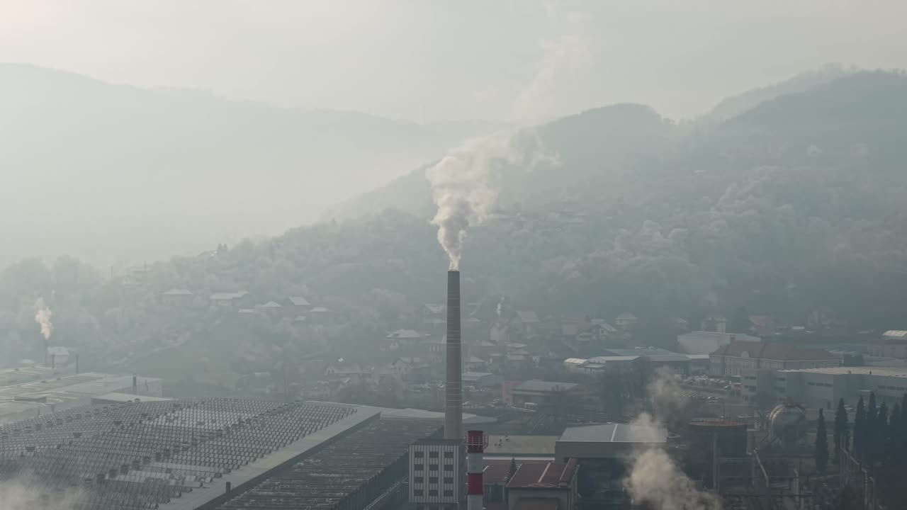 Drone Shot of Dangerous Smoke From Factory Chimney Going Into Atmosphere on Misty Autumn Day