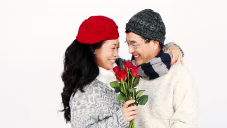 asian man giving roses to his wife