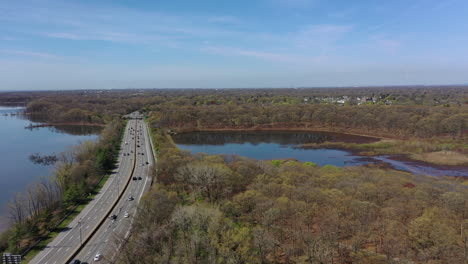 an aerial view over reflective lakes during a clear day