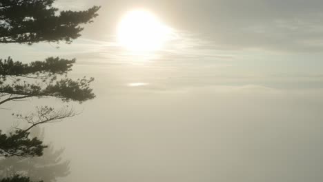 Sunrise over lake superior at bare bluff with morning fog rolling in