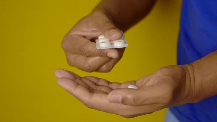 Person taking pills