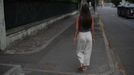 woman walking down a city street