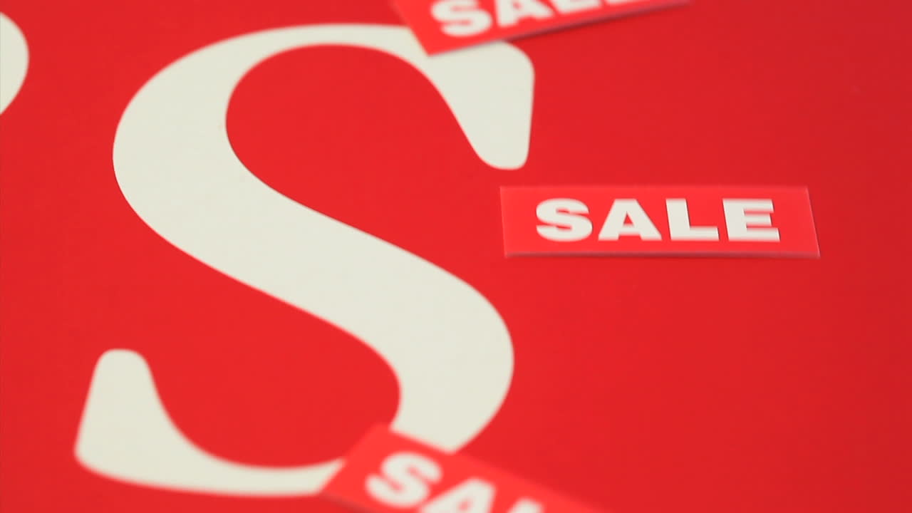 palabra de venta escrita varias veces en blanco girando