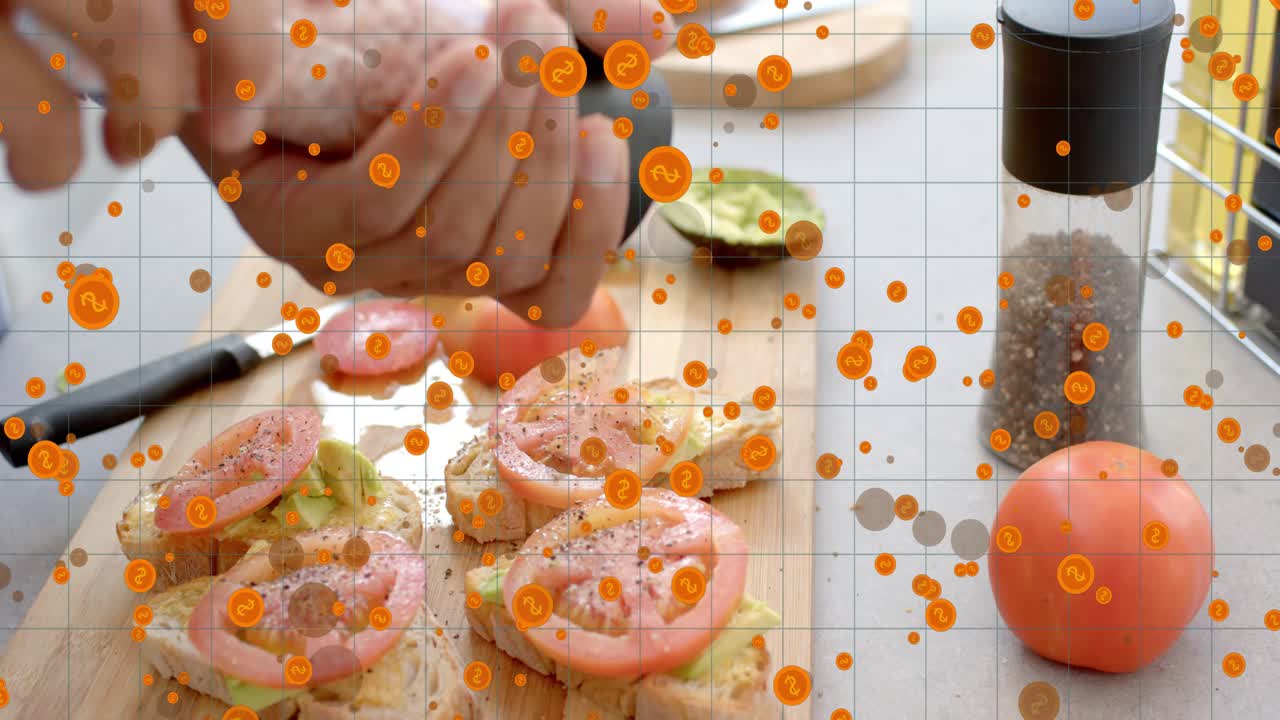 Cook's hands grabbing pepper mill, peppering toasts for flavor, grid and orange confetti rising