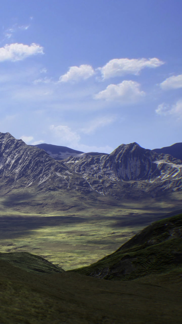 Mountains stand tall under a bright midday sky in natures embrace