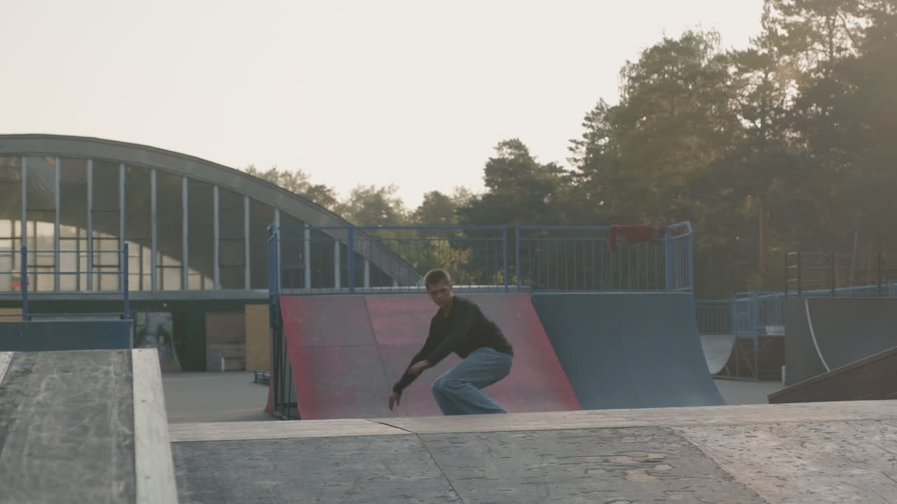 Teenager Skating and Doing Trick on Ramp