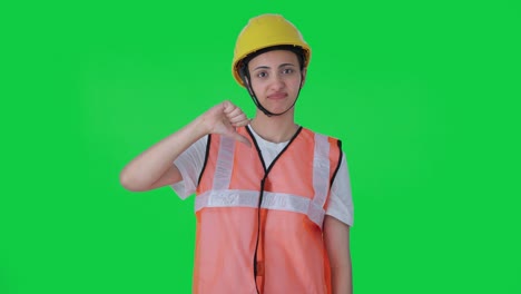 Upset-Indian-female-construction-worker-showing-thumbs-down-Green-screen