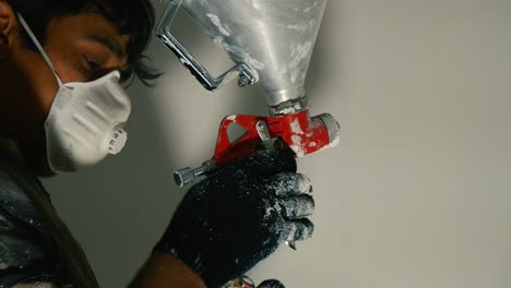 spraying plaster on wall