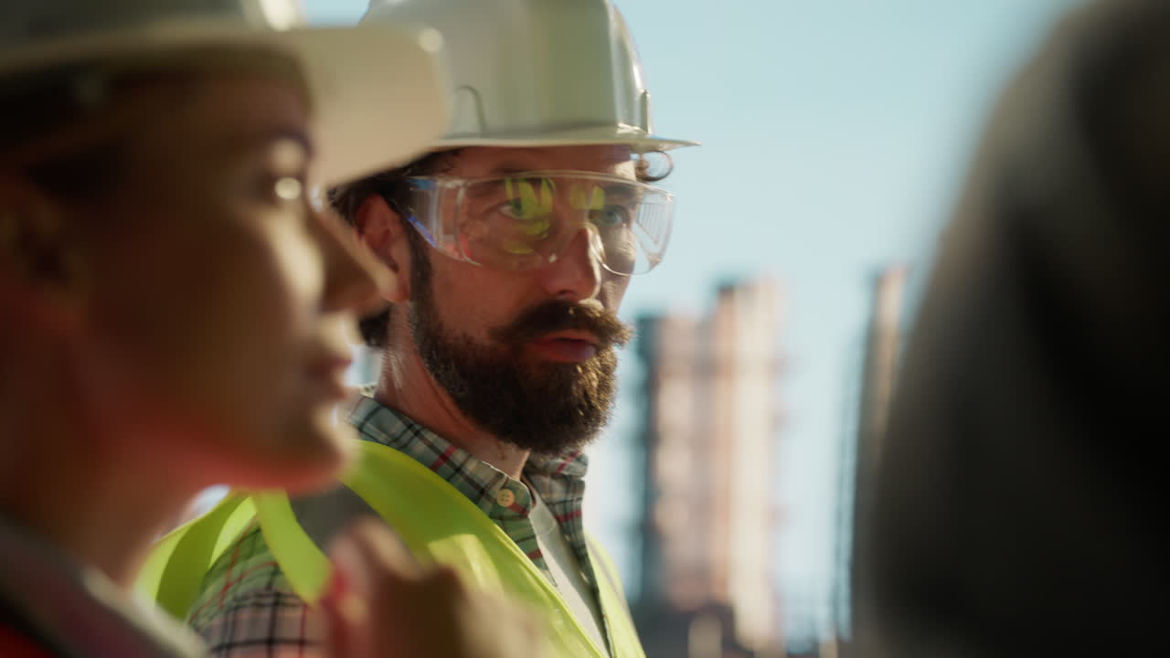 Construction professionals wearing hard hats and safety vests