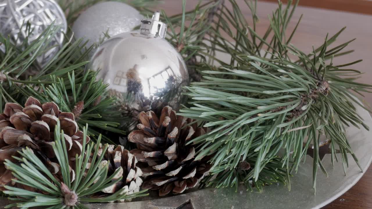 Festive pine cones and ornaments create a cozy Christmas atmosphere